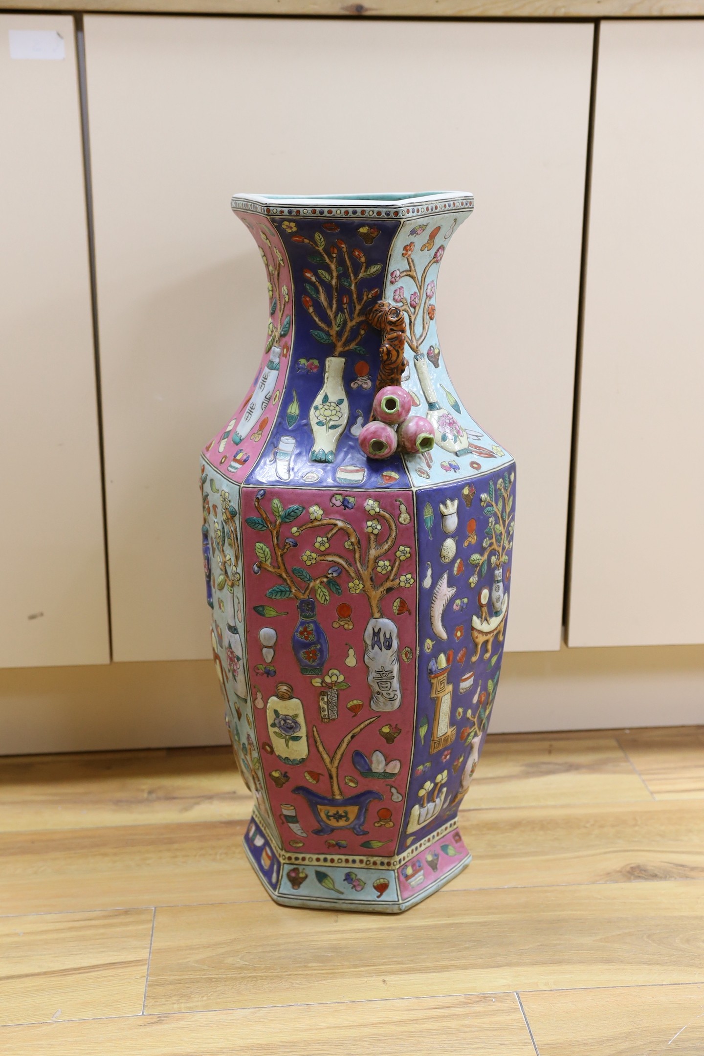 A large Chinese famille rose two handled hexagonal vase. 64cm tall